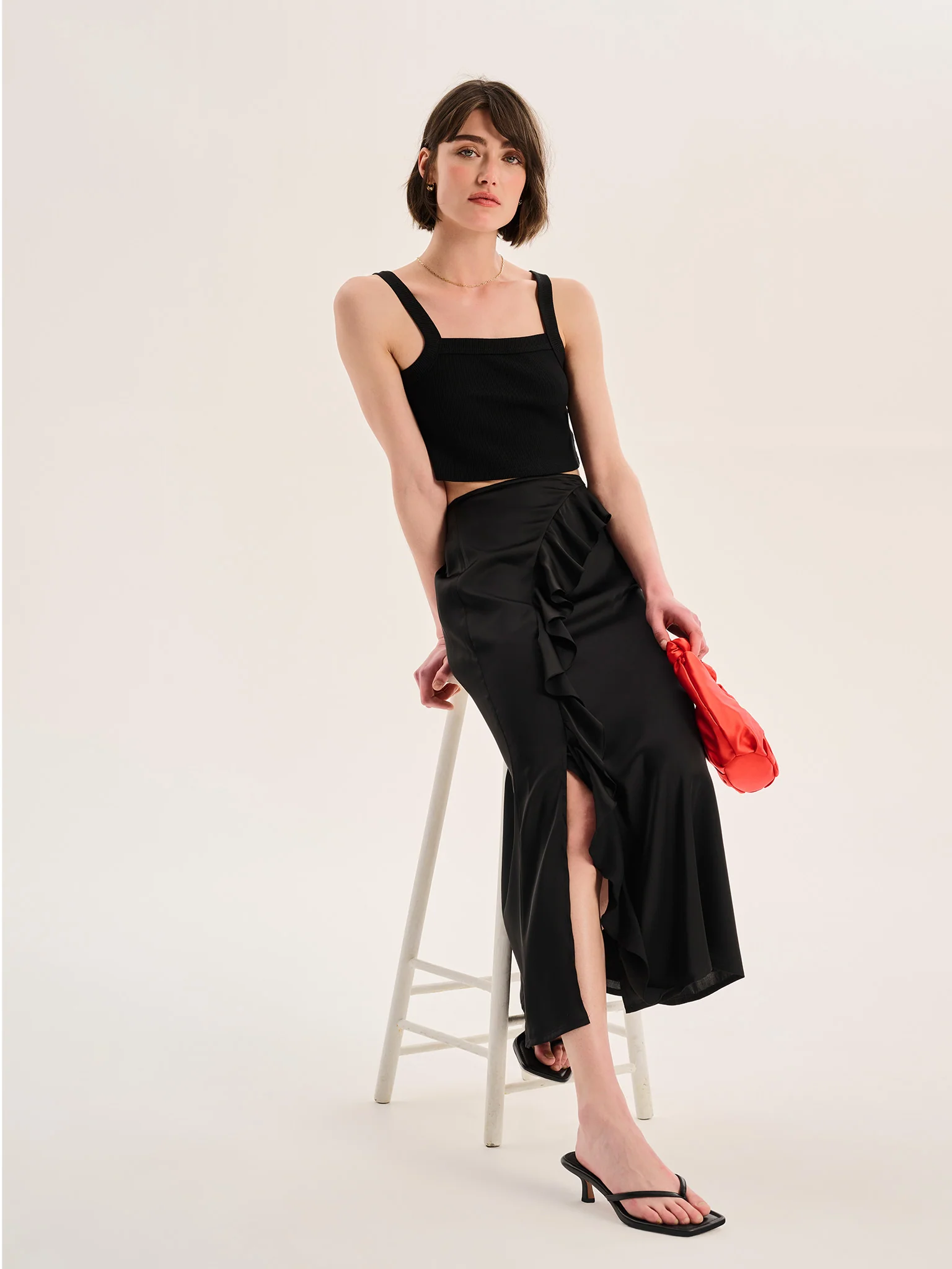 Udita Ruffle Detail Midi Satin Skirt in Black - Image 3